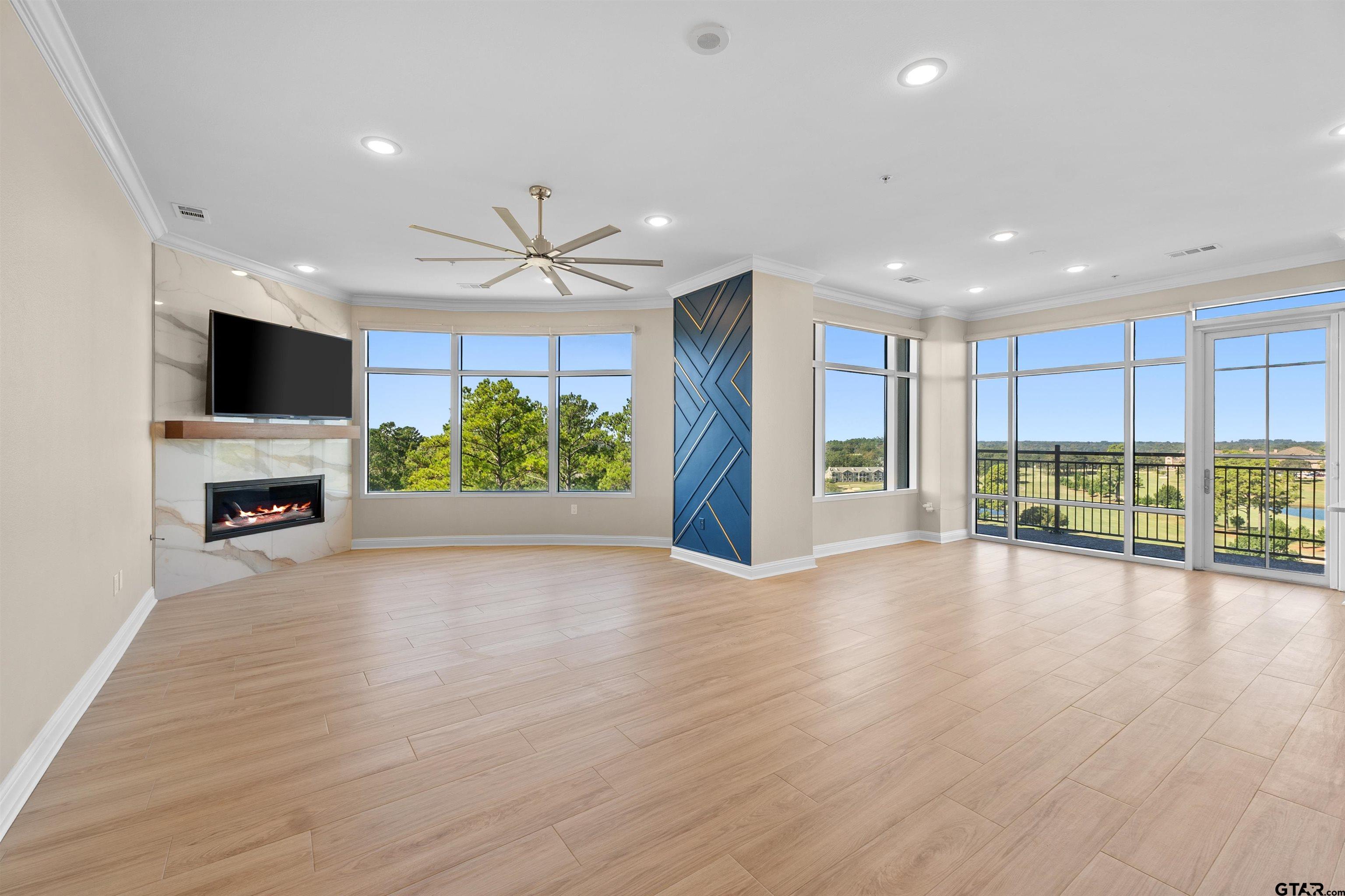 2801 Wexford Drive Tyler, TX 75709 - Photo 17 of 31 a view of an empty room with a window and wooden floor