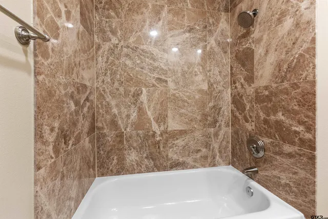 a bathroom with a bathtub