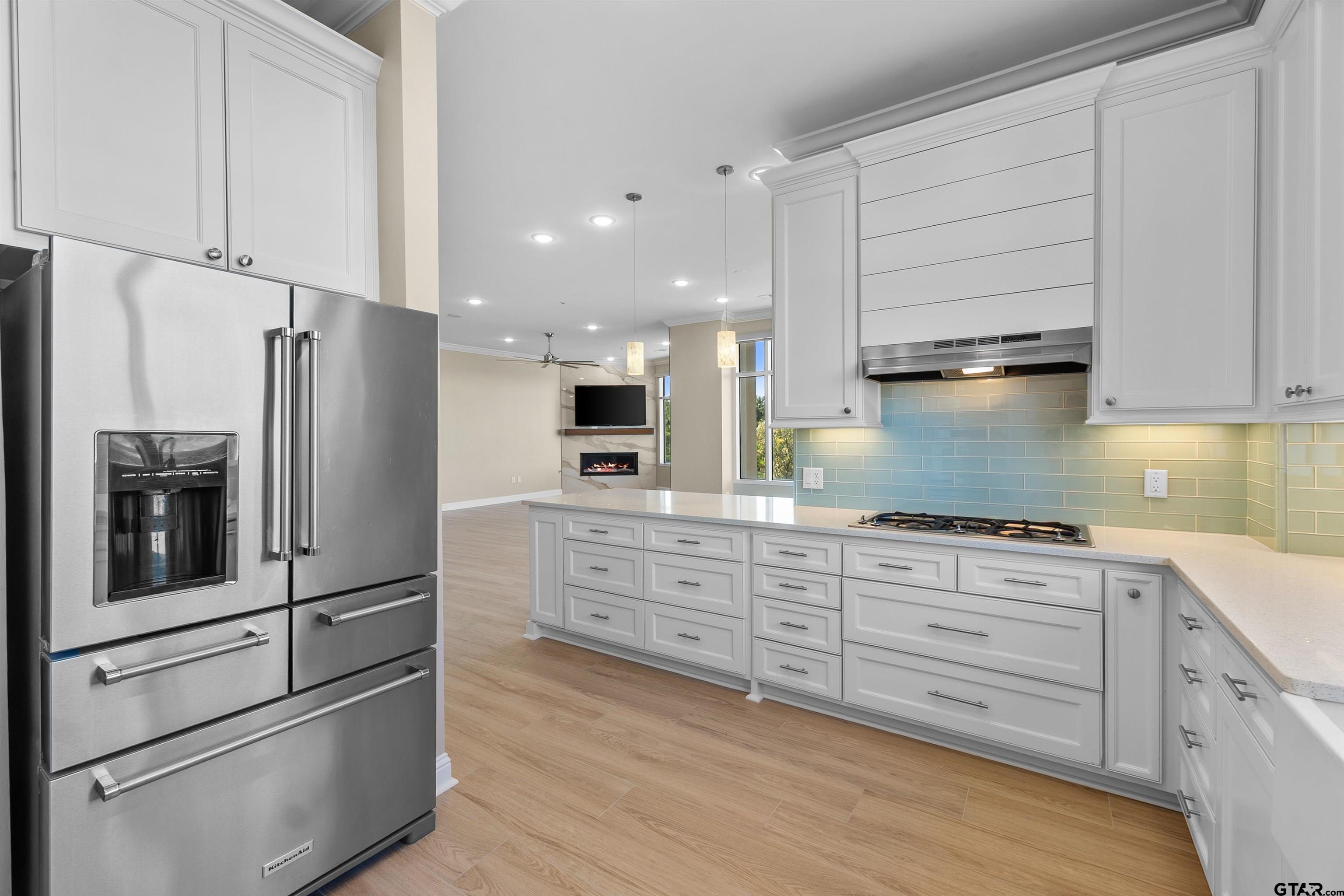 2801 Wexford Drive Tyler, TX 75709 - Photo 23 of 31 a kitchen with stainless steel appliances granite countertop a refrigerator and a stove top oven