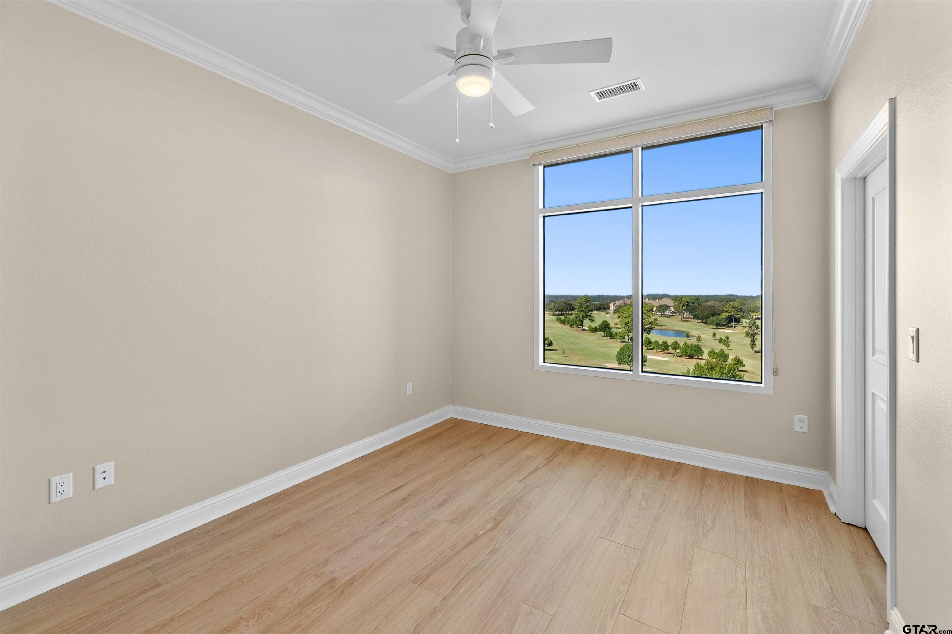 2801 Wexford Drive Tyler, TX 75709 - Photo 26 of 31 wooden floor in an empty room with a window