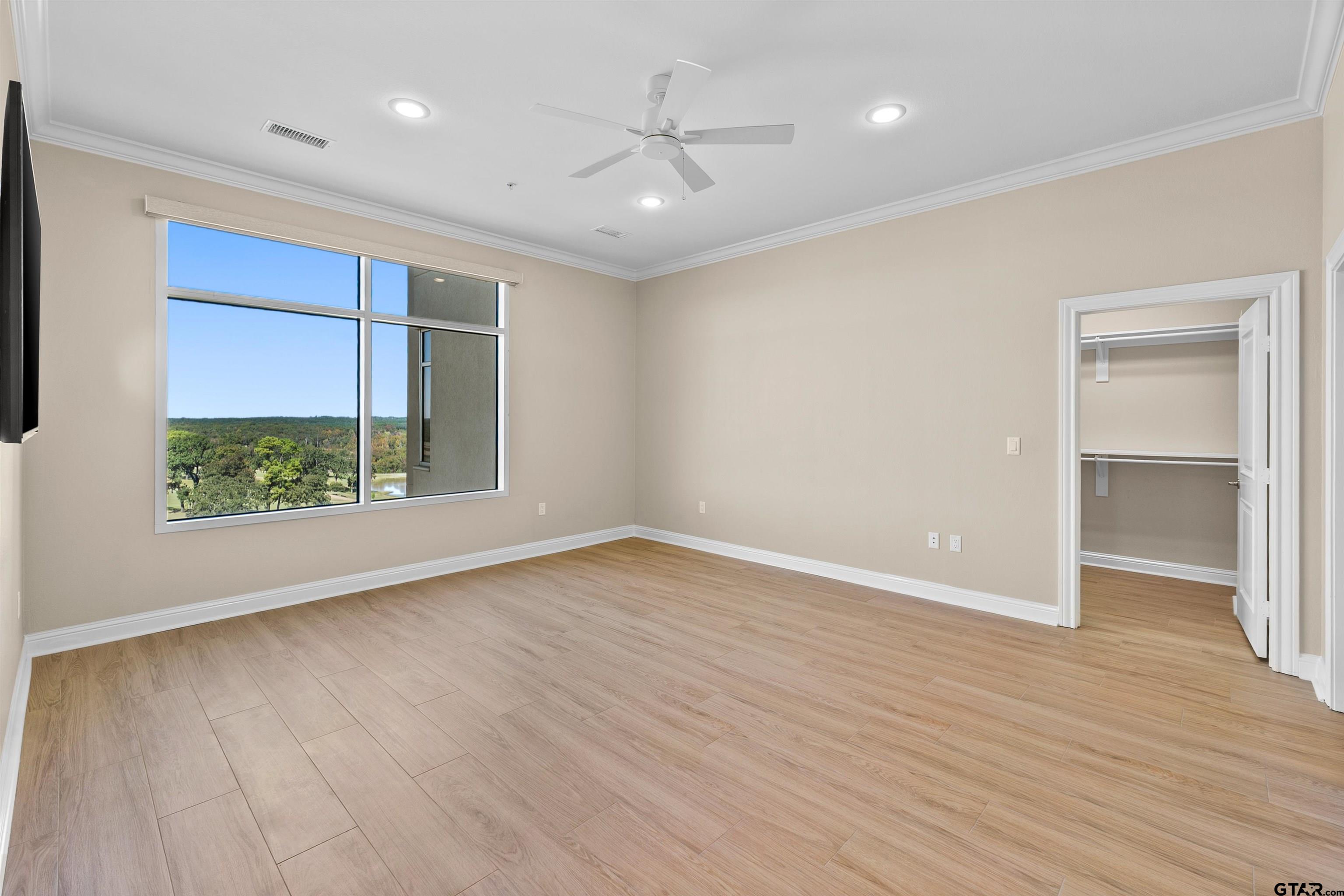 2801 Wexford Drive Tyler, TX 75709 - Photo 4 of 31 wooden floor in an empty room with a window