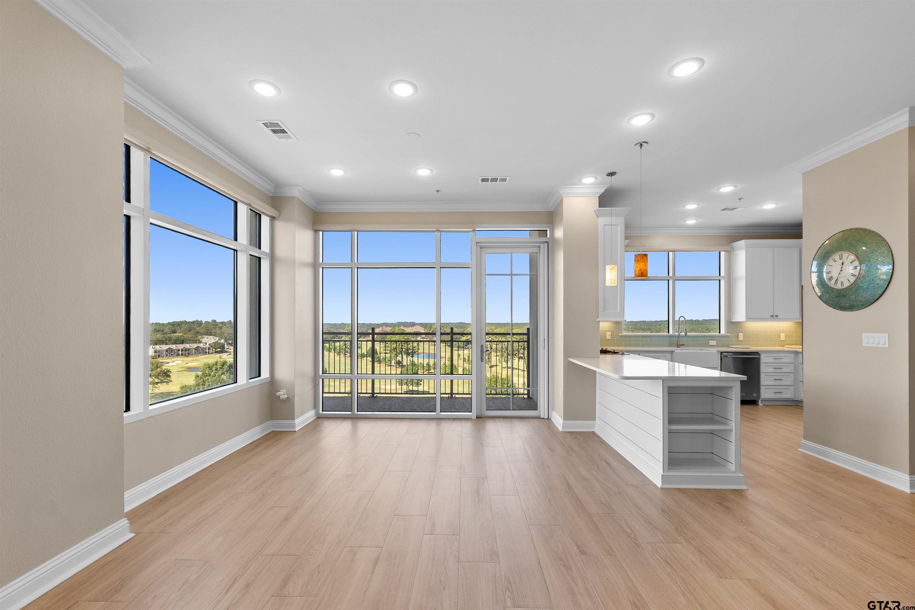 2801 Wexford Drive Tyler, TX 75709 - Photo 8 of 31 wooden floor with kitchen view