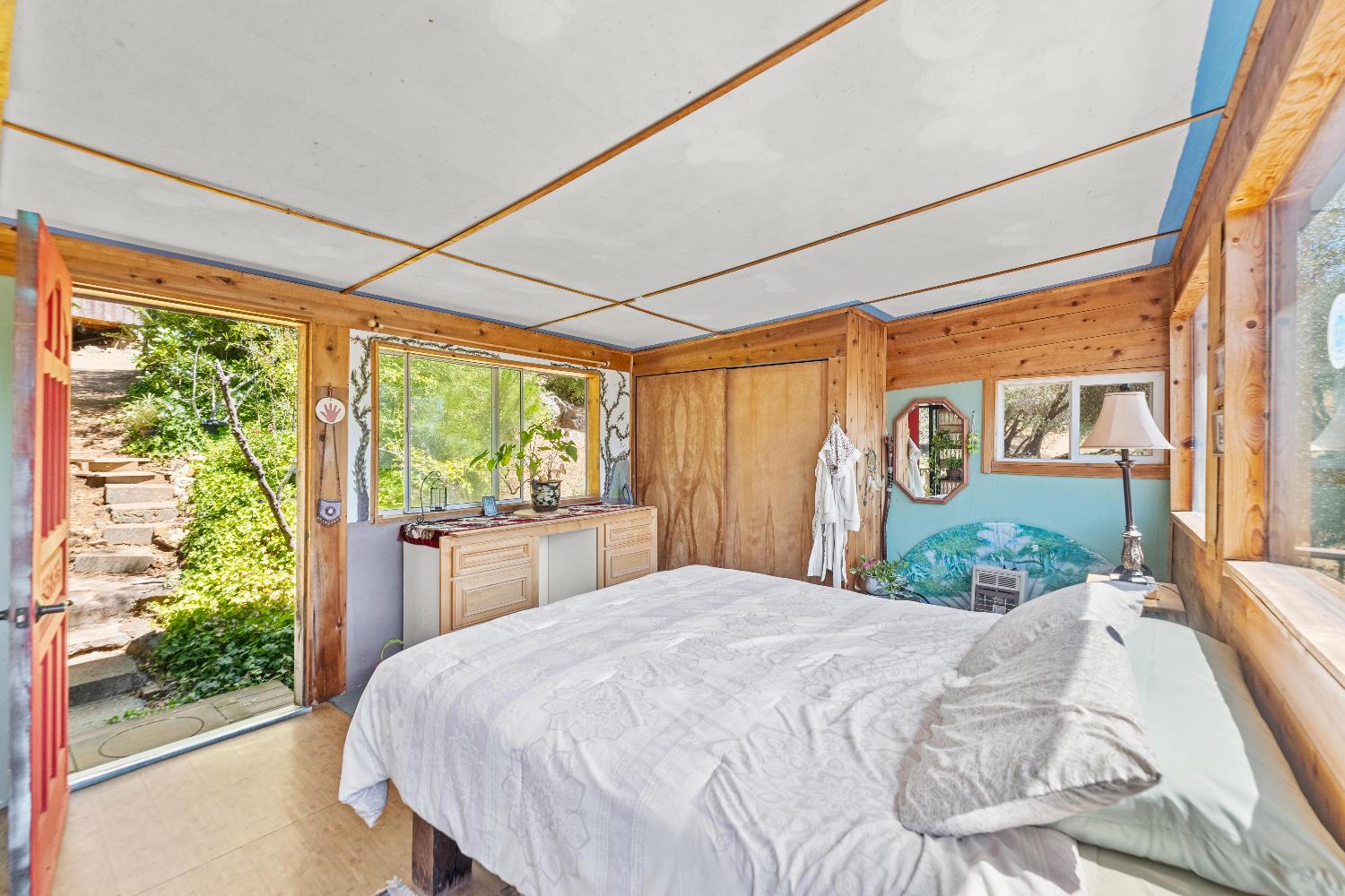 23650 Tundra Road Auburn, CA 95602 - Photo 24 of 45 a bed sitting in a bedroom next to a window