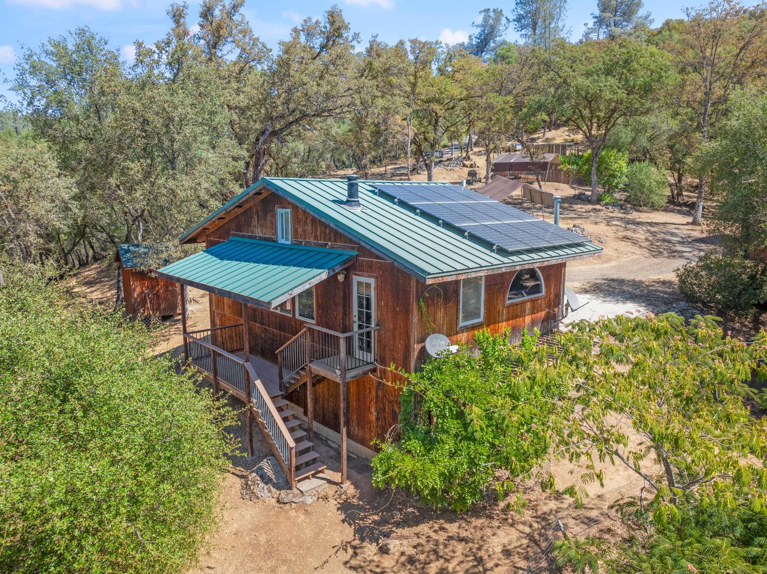 23650 Tundra Road Auburn, CA 95602 - Photo 28 of 45 an aerial view of a house with a yard table and chairs