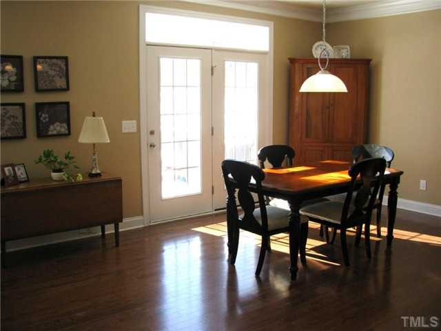 13019 Saxon Way Raleigh, NC 27613 - Photo 4 of 12 Spacious breakfast nook which opens to expanded deck and large back yard. Gorgeous hardwoods throughout entire first floor!