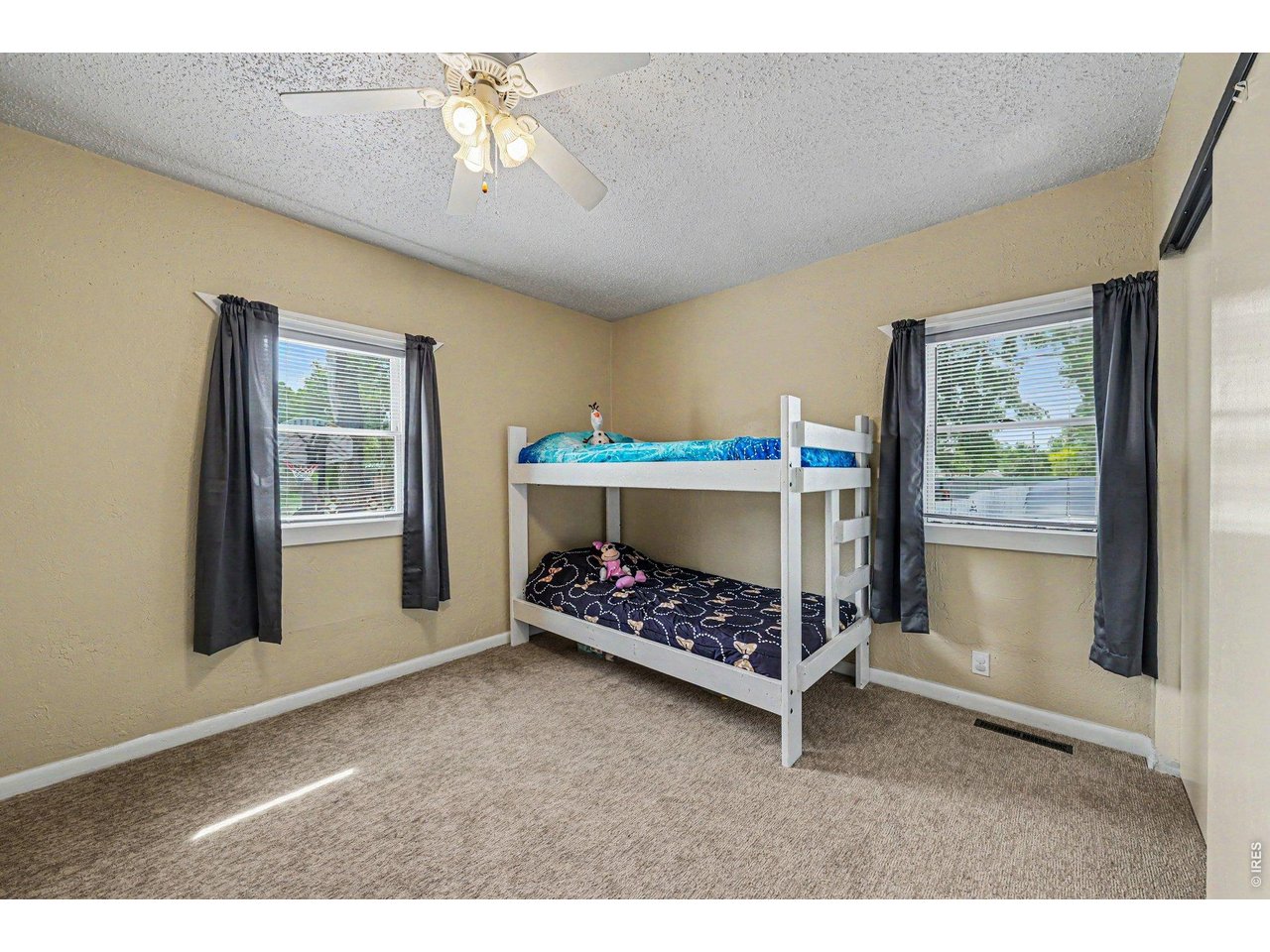 1430 30th Street Road Greeley, CO 80631 - Photo 14 of 22 a bedroom with furniture and a window