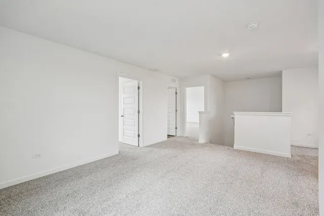 an empty room with closet area
