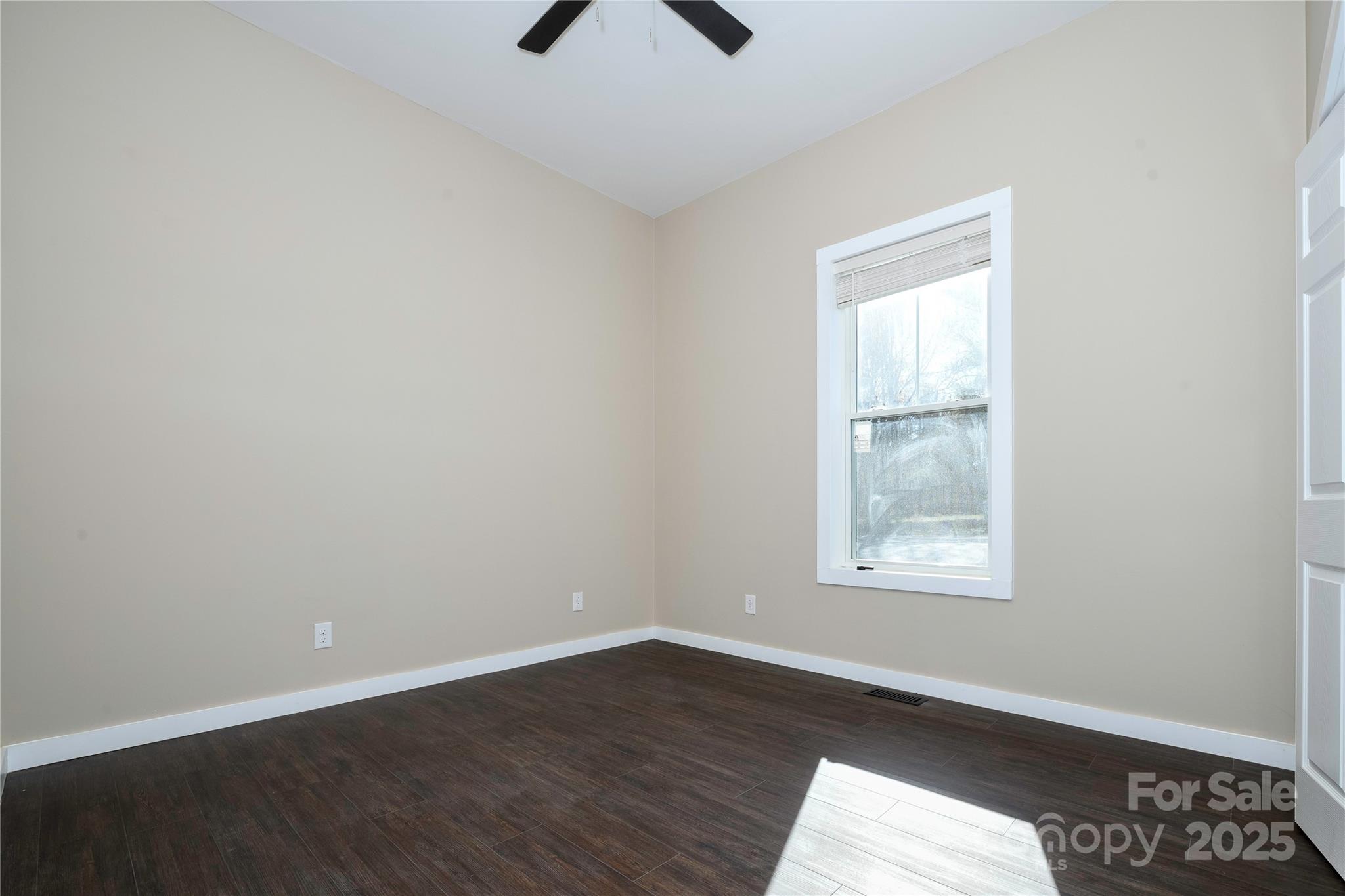 2162 Watson Road Lenoir, NC 28645 - Photo 20 of 23 an empty room with wooden floor and windows