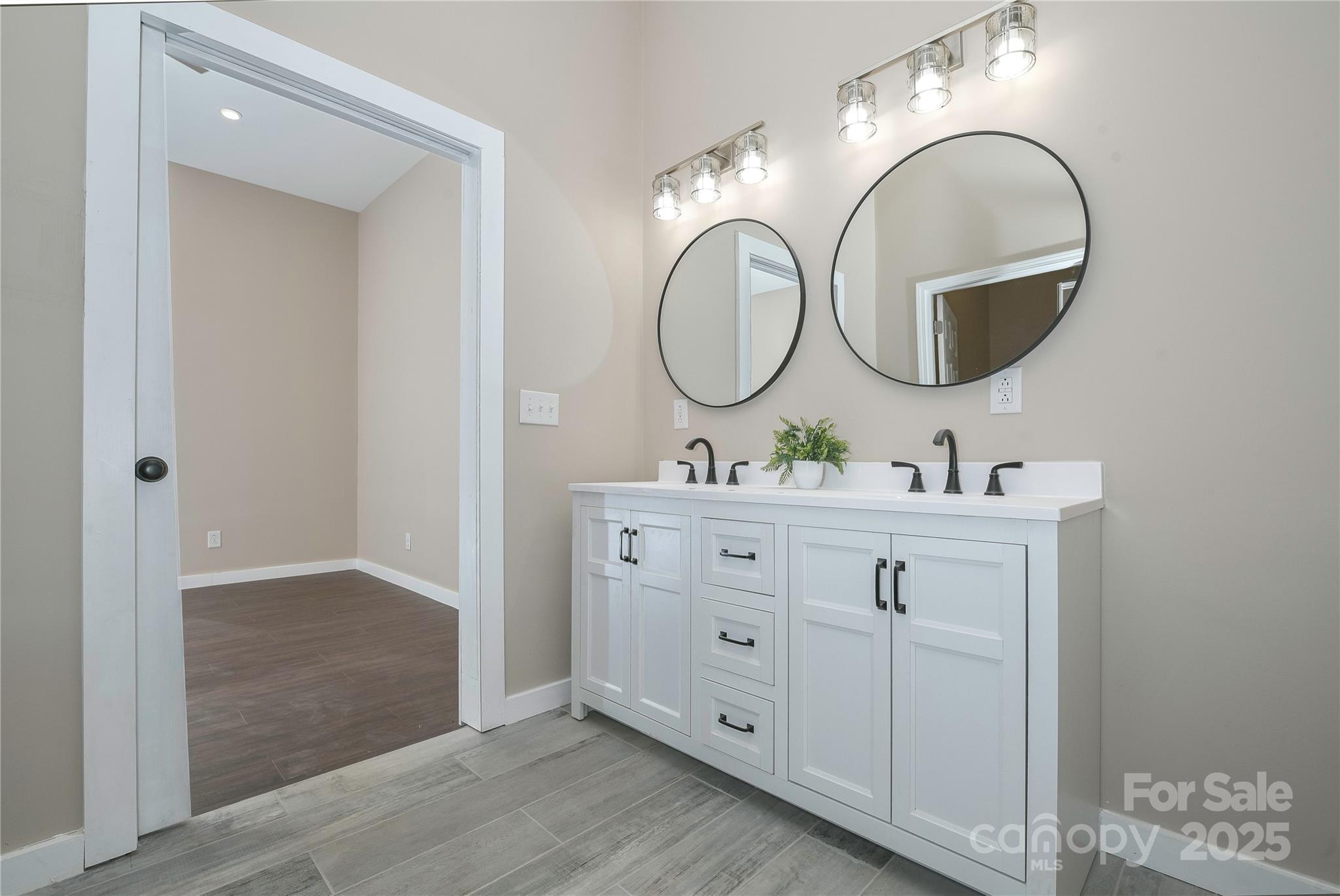 2162 Watson Road Lenoir, NC 28645 - Photo 23 of 23 a bathroom with a double vanity sink and a mirror