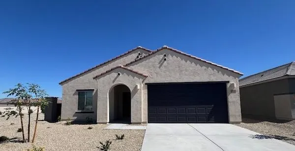 a front view of a house with a garage