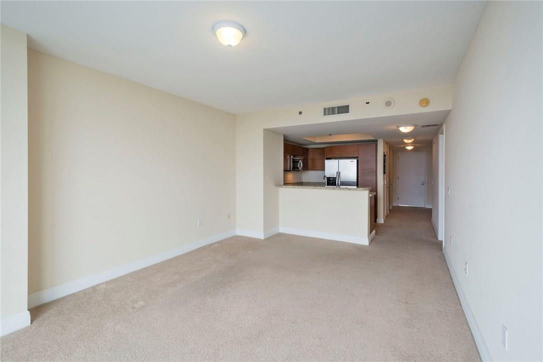 2681 North Flamingo Road, Unit S902 Sunrise, FL 33323 - Photo 21 of 29 Living room looking into the kitchen
