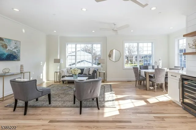 a living room with fireplace furniture and a table
