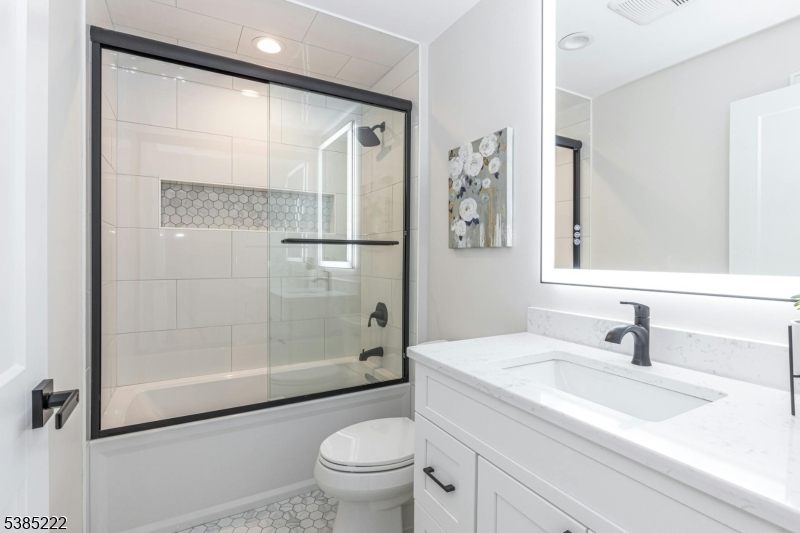 484 4th Avenue, Unit 9 Garwood, NJ 07027 - Photo 22 of 28 a bathroom with a sink toilet and shower
