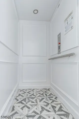 a view of a refrigerator in kitchen and utility room