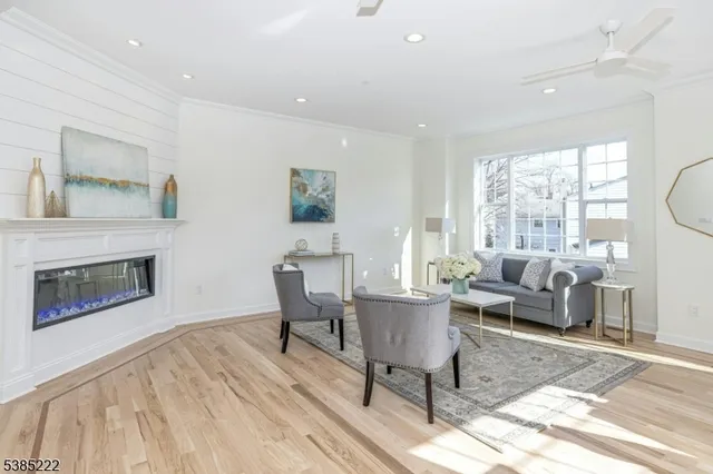 a living room with furniture a fireplace and a table