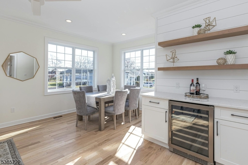 484 4th Avenue, Unit 9 Garwood, NJ 07027 - Photo 7 of 28 a kitchen with a table chairs and a window
