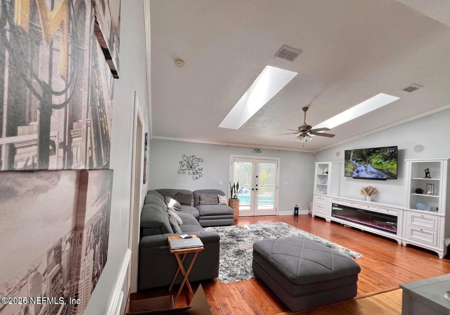 3419 Bristol Bridge Road Orange Park, FL 32073 - Photo 14 of 36 a living room with furniture and a flat screen tv