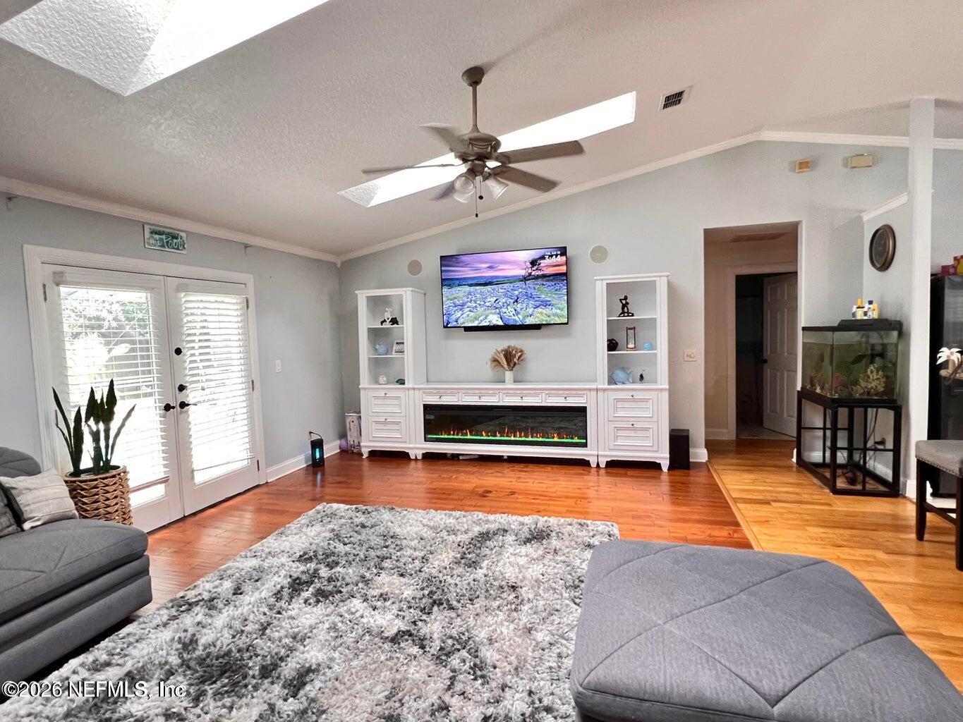 3419 Bristol Bridge Road Orange Park, FL 32073 - Photo 15 of 36 a living room with furniture pool table and a large window