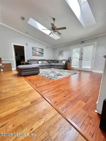 a view of a livingroom with furniture nad wooden floor