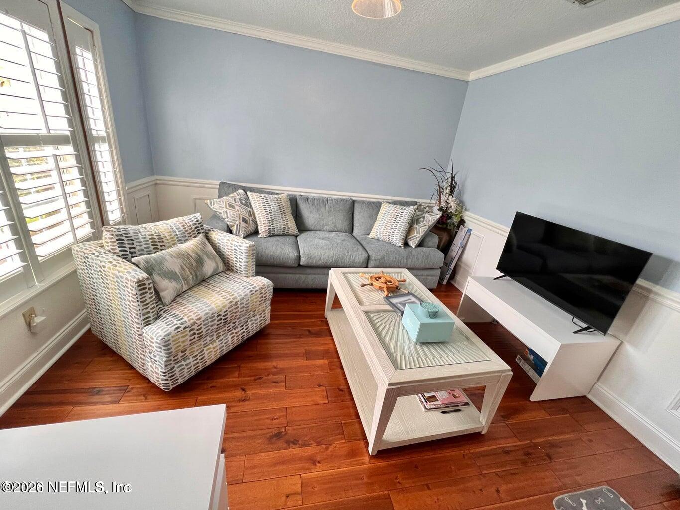 3419 Bristol Bridge Road Orange Park, FL 32073 - Photo 18 of 36 a living room with furniture and a flat screen tv