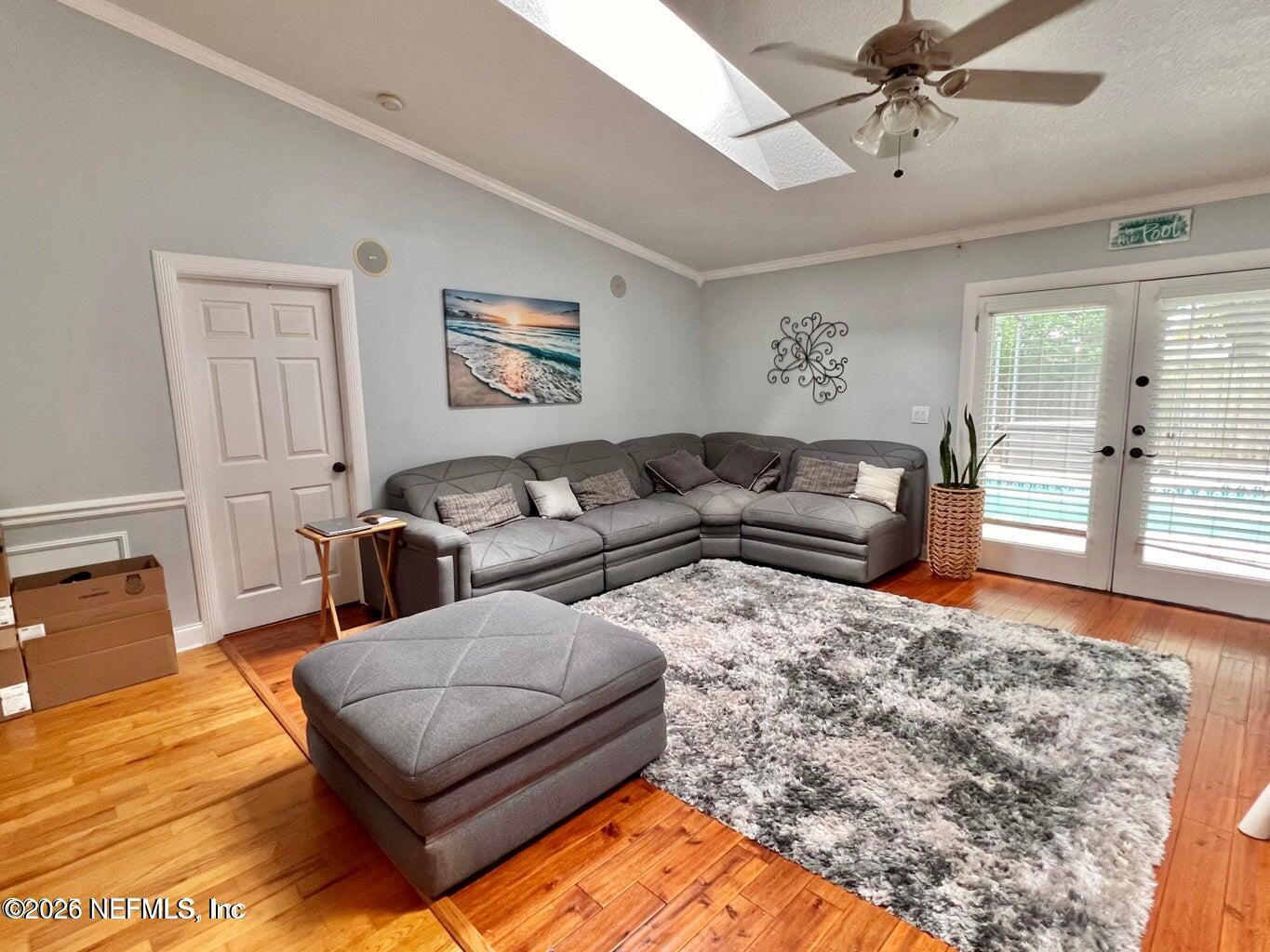 3419 Bristol Bridge Road Orange Park, FL 32073 - Photo 23 of 36 a living room with furniture window and wooden floor
