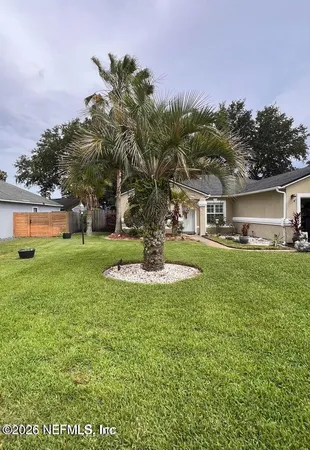 a view of a house with a big yard
