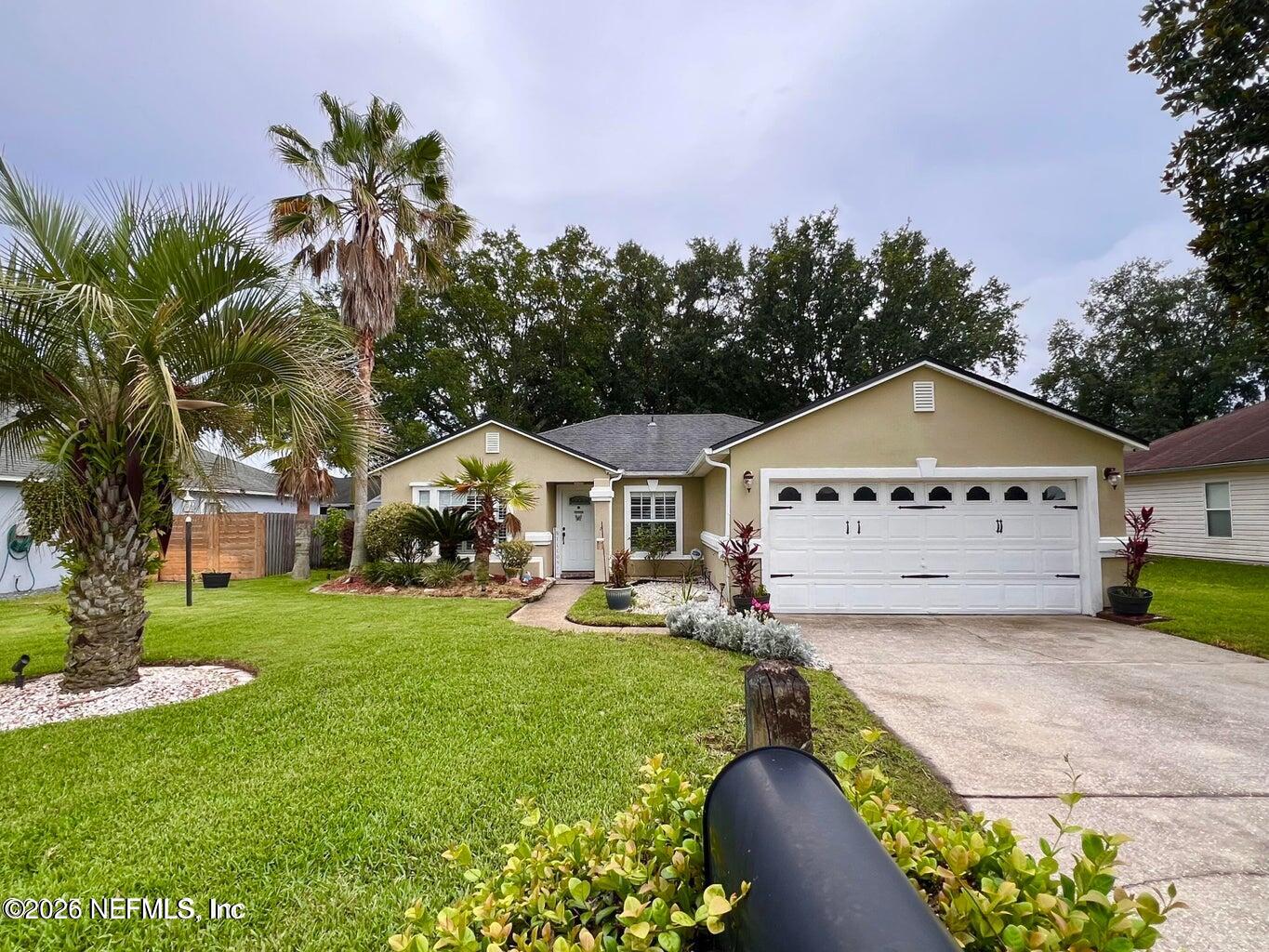 3419 Bristol Bridge Road Orange Park, FL 32073 - Photo 34 of 36 a front view of a house with garden