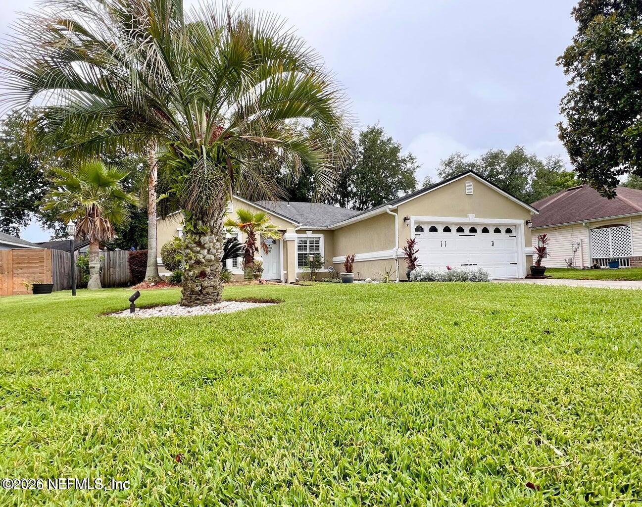 3419 Bristol Bridge Road Orange Park, FL 32073 - Photo 36 of 36 a front view of a house with garden