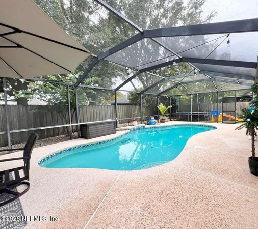 a view of yard with swimming pool