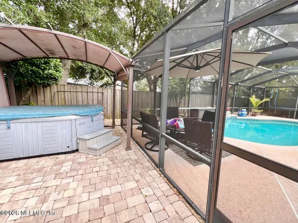 a outdoor view of a pathway with a backyard