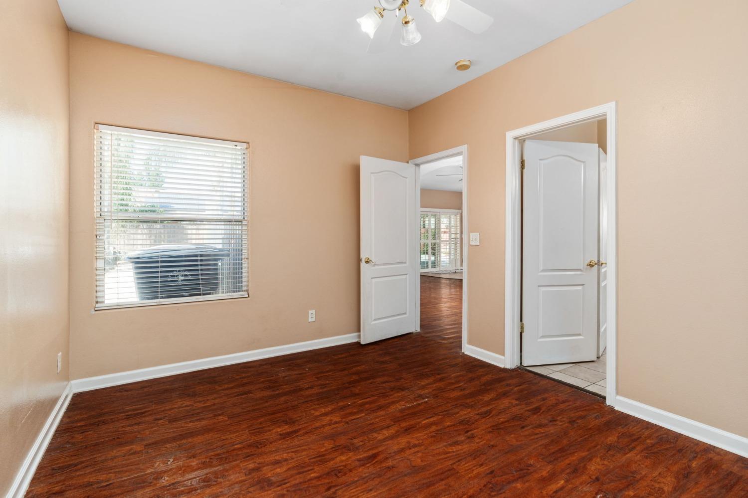 2763 Pico Avenue Clovis, CA 93611 - Photo 16 of 27 a view of an empty room with wooden floor and a window