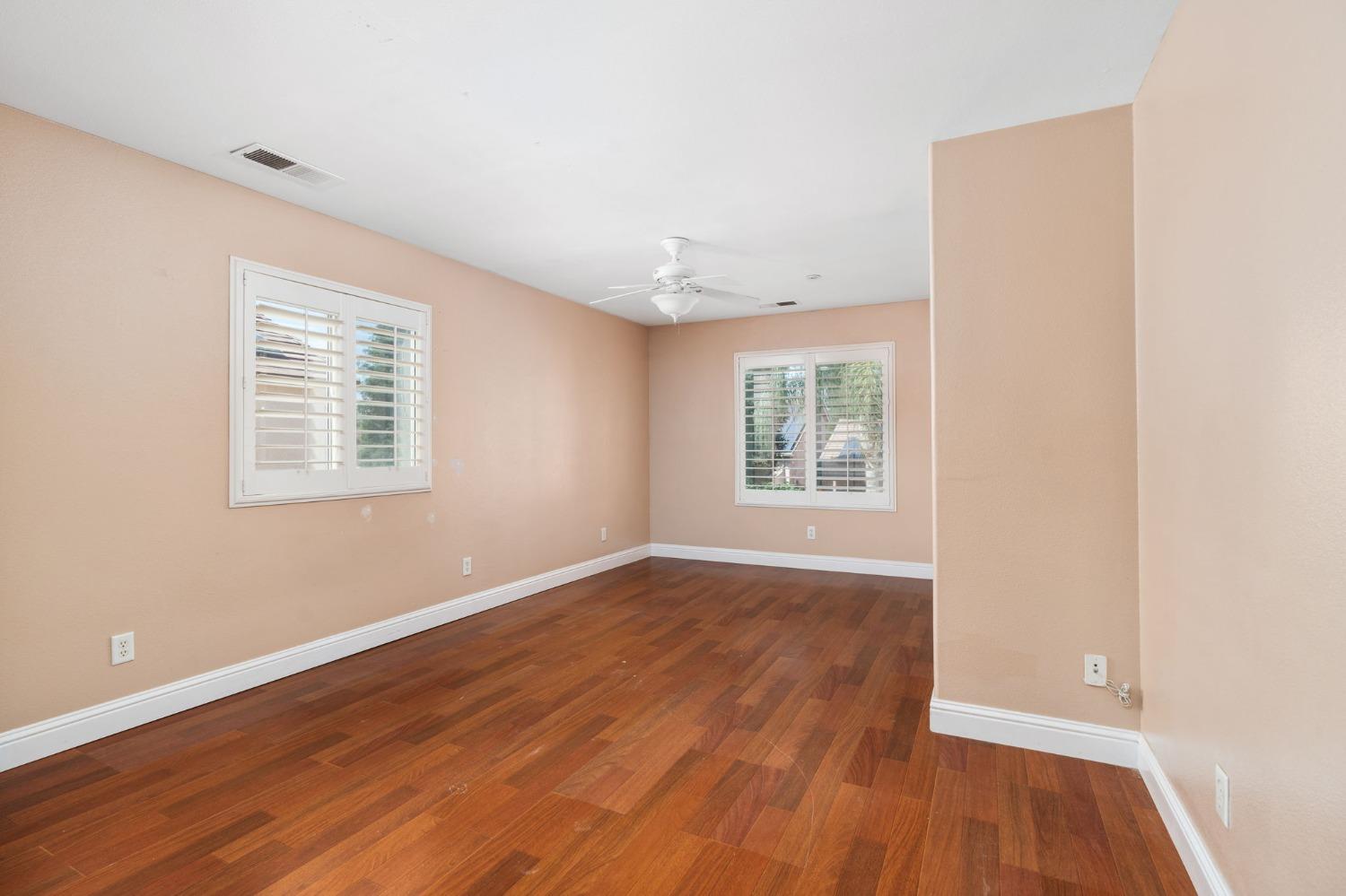 2763 Pico Avenue Clovis, CA 93611 - Photo 19 of 27 an empty room with wooden floor and windows