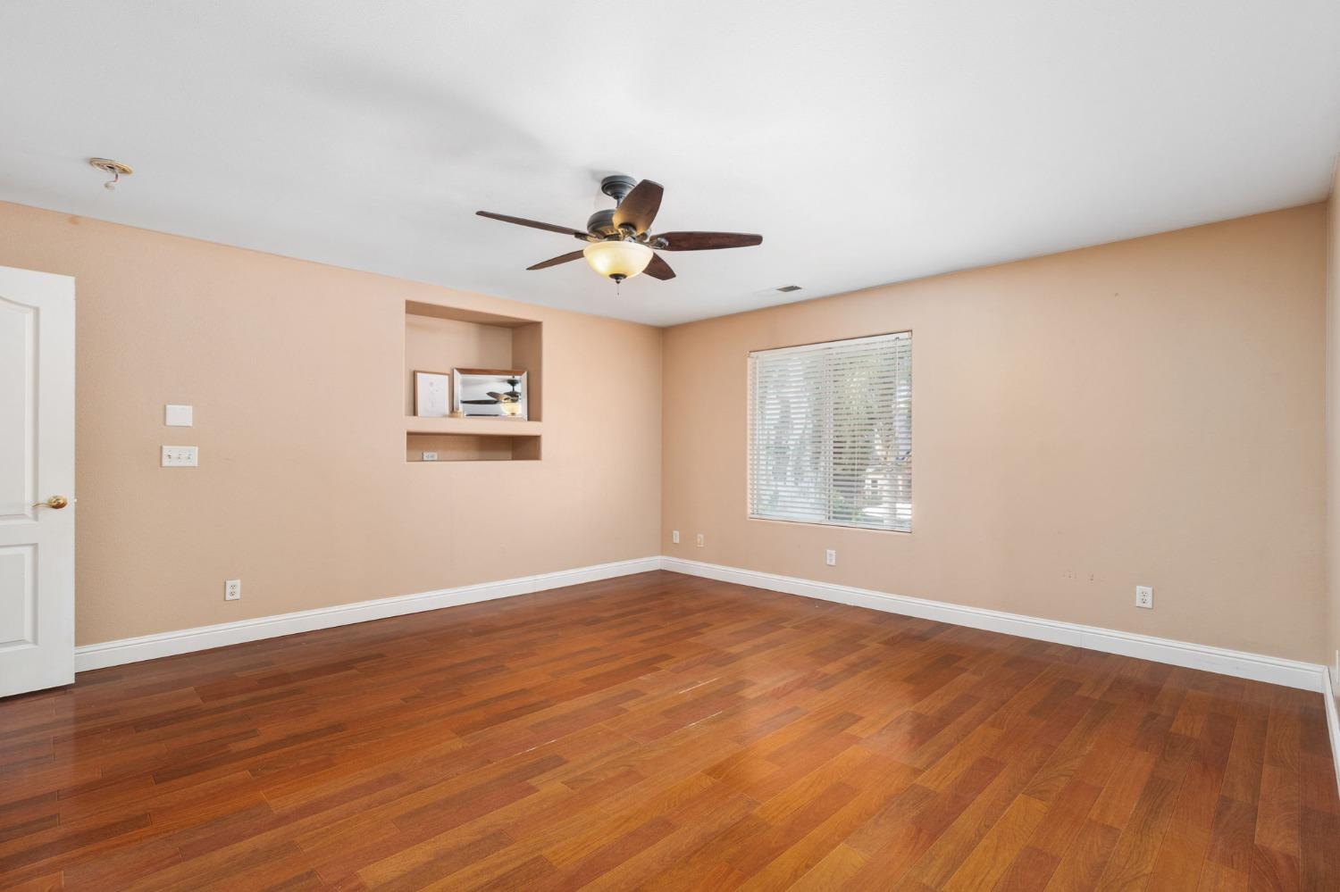 2763 Pico Avenue Clovis, CA 93611 - Photo 21 of 27 an empty room with wooden floor and windows