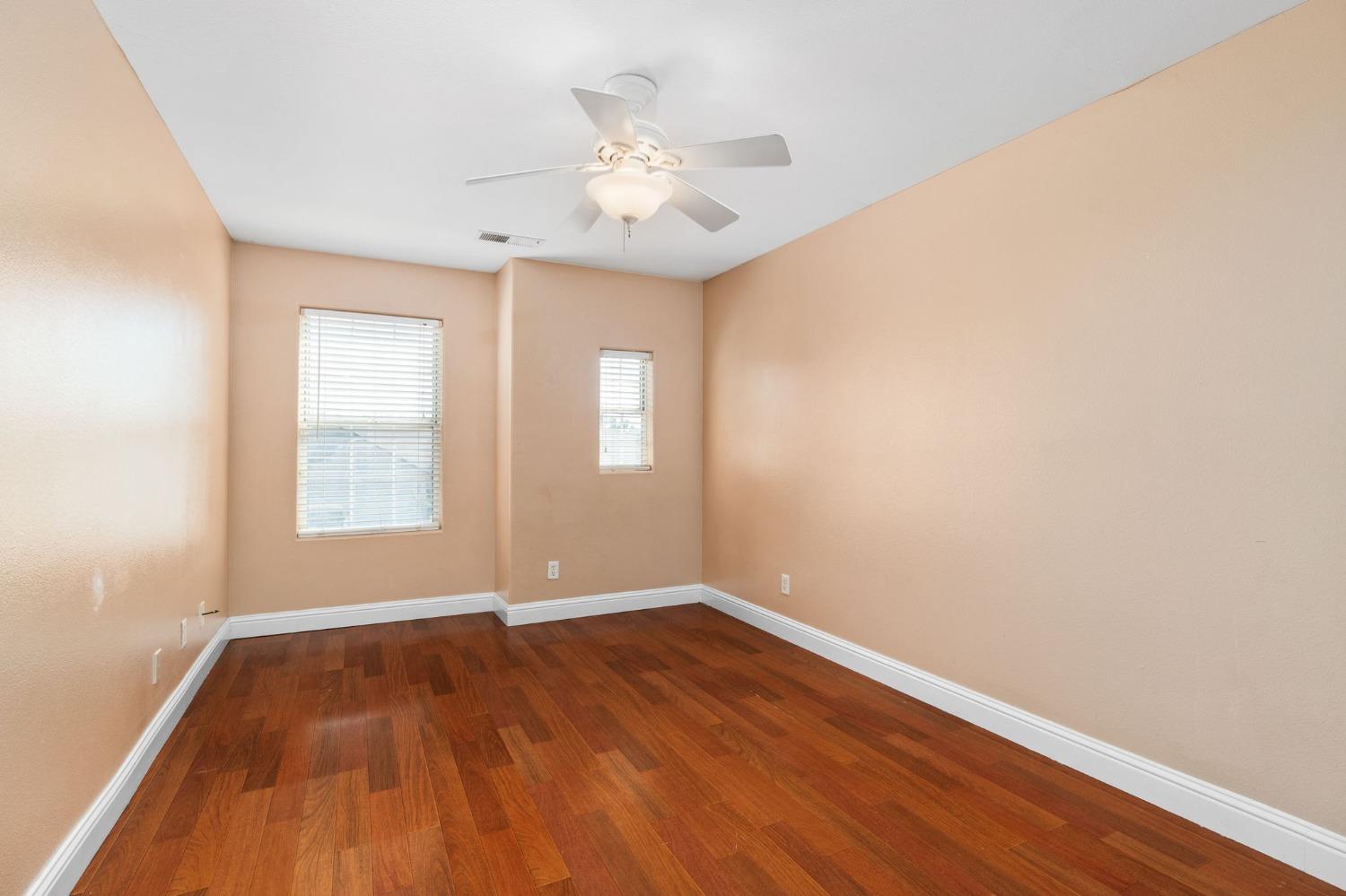 2763 Pico Avenue Clovis, CA 93611 - Photo 25 of 27 an empty room with wooden floor and windows