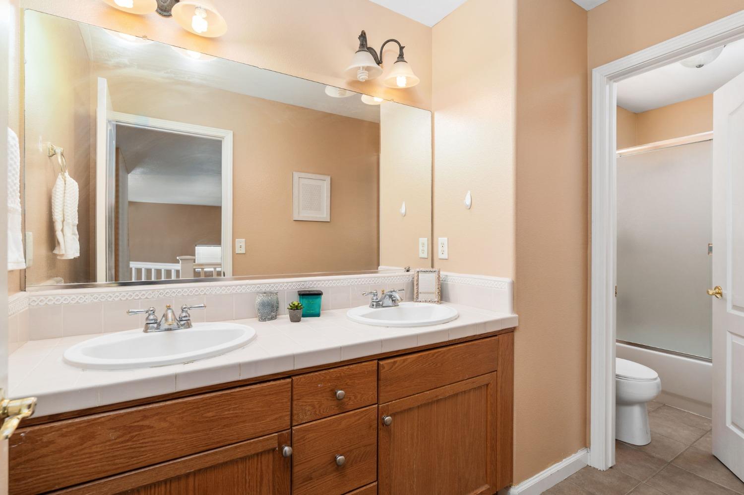 2763 Pico Avenue Clovis, CA 93611 - Photo 26 of 27 a bathroom with a sink and a mirror