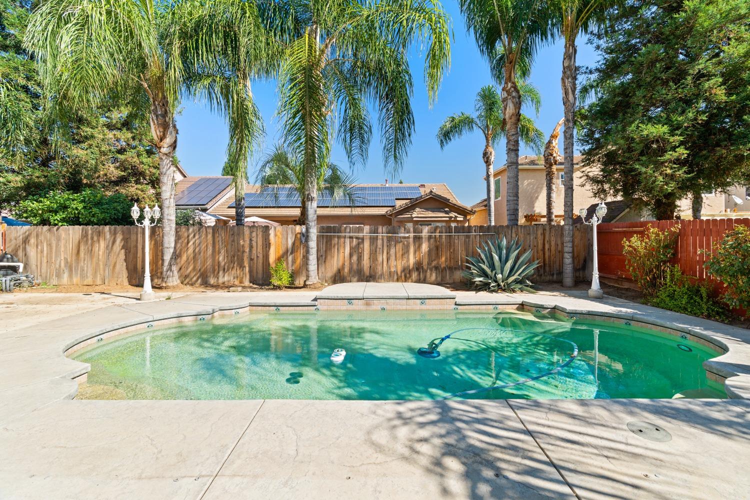 2763 Pico Avenue Clovis, CA 93611 - Photo 27 of 27 a view of a backyard with a garden and swimming pool
