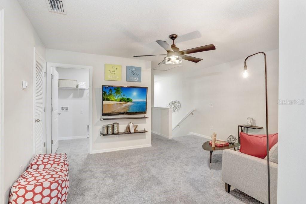 5349 Coldpine Place Seffner, FL 33584 - Photo 13 of 24 a living room with furniture and a flat screen tv
