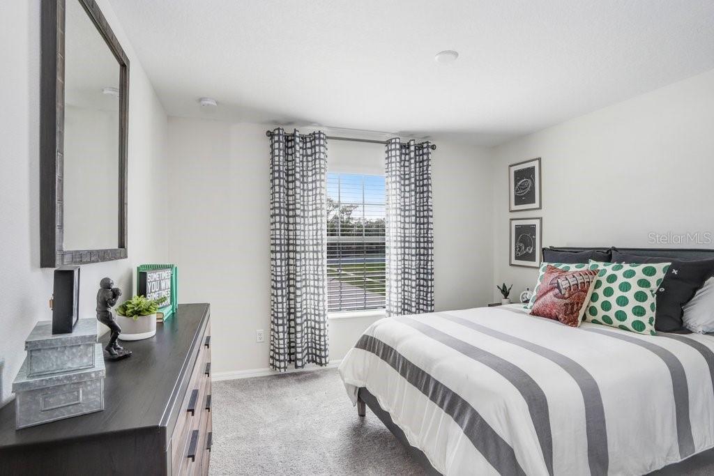 5349 Coldpine Place Seffner, FL 33584 - Photo 19 of 24 a bedroom with a bed and a window