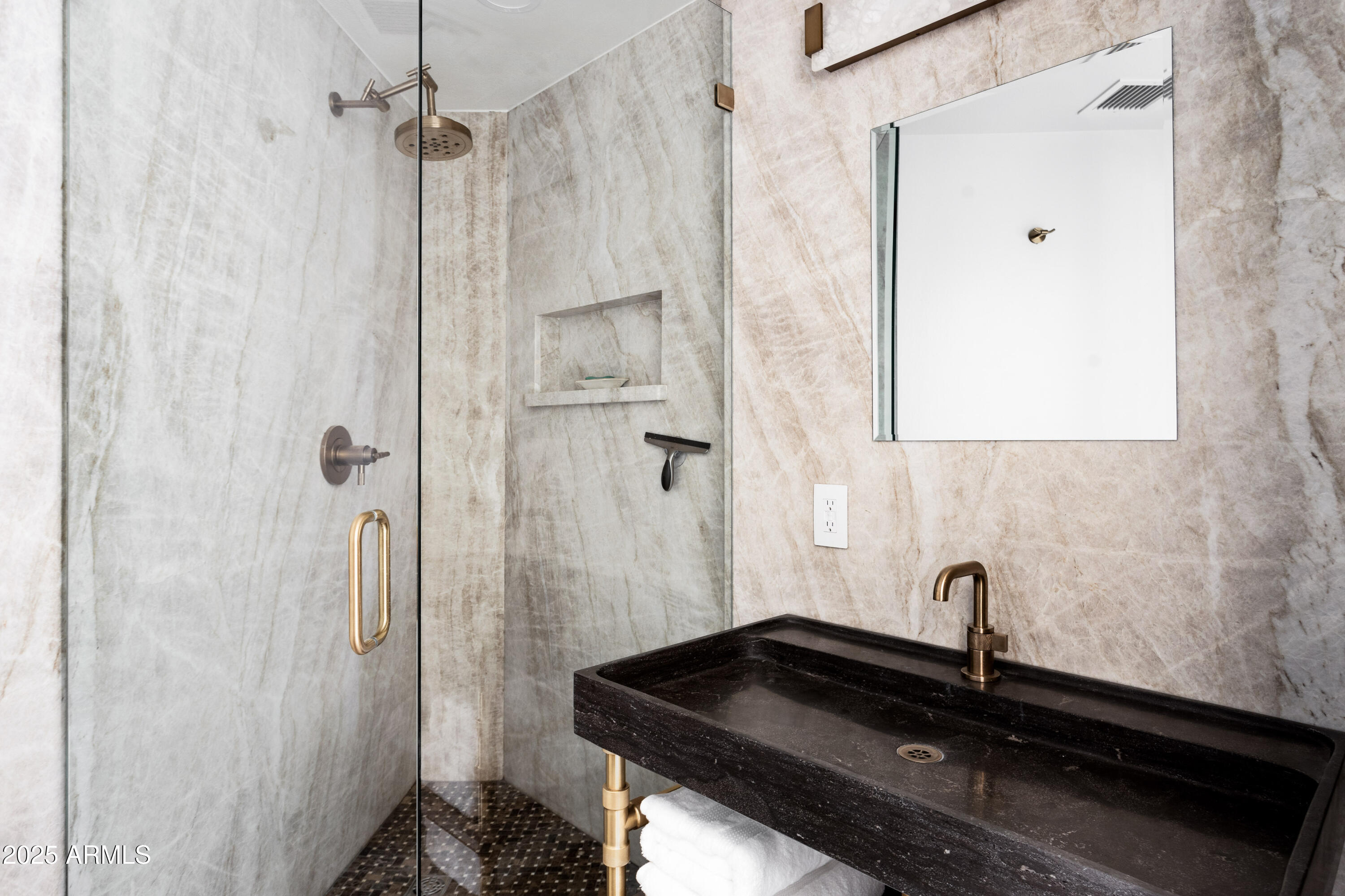 1040 East Osborn Road, Unit 904 Phoenix, AZ 85014 - Photo 17 of 22 a bathroom with a sink and a mirror