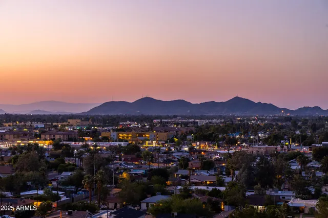 a view of a city with mountains in the background