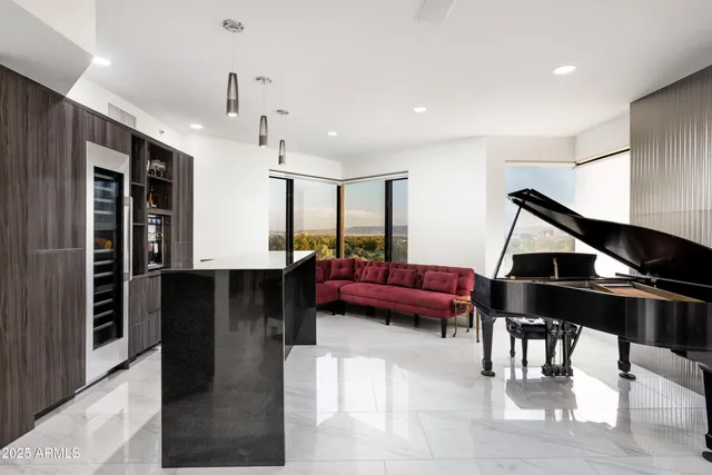 a living room with furniture a ceiling fan and a rug
