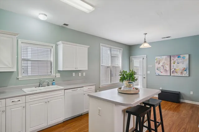 a kitchen with a table and chairs in it