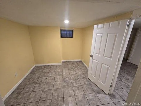 a view of a livingroom with wooden floor and entryway