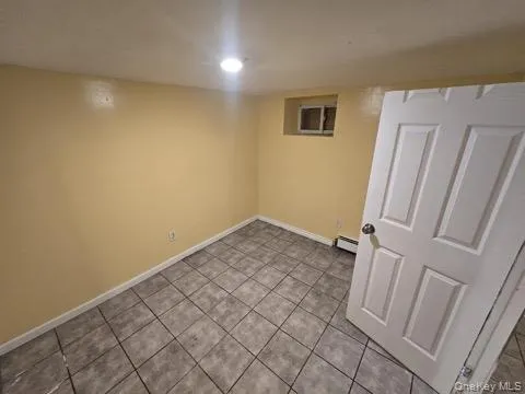a view of room with window and hardwood floor