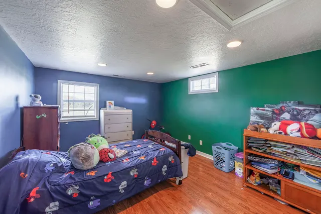 a bedroom with a bed and a dresser