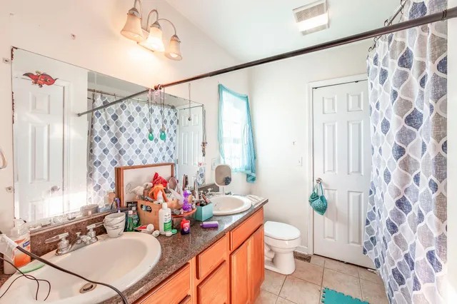 a bed room with a bed and a tv