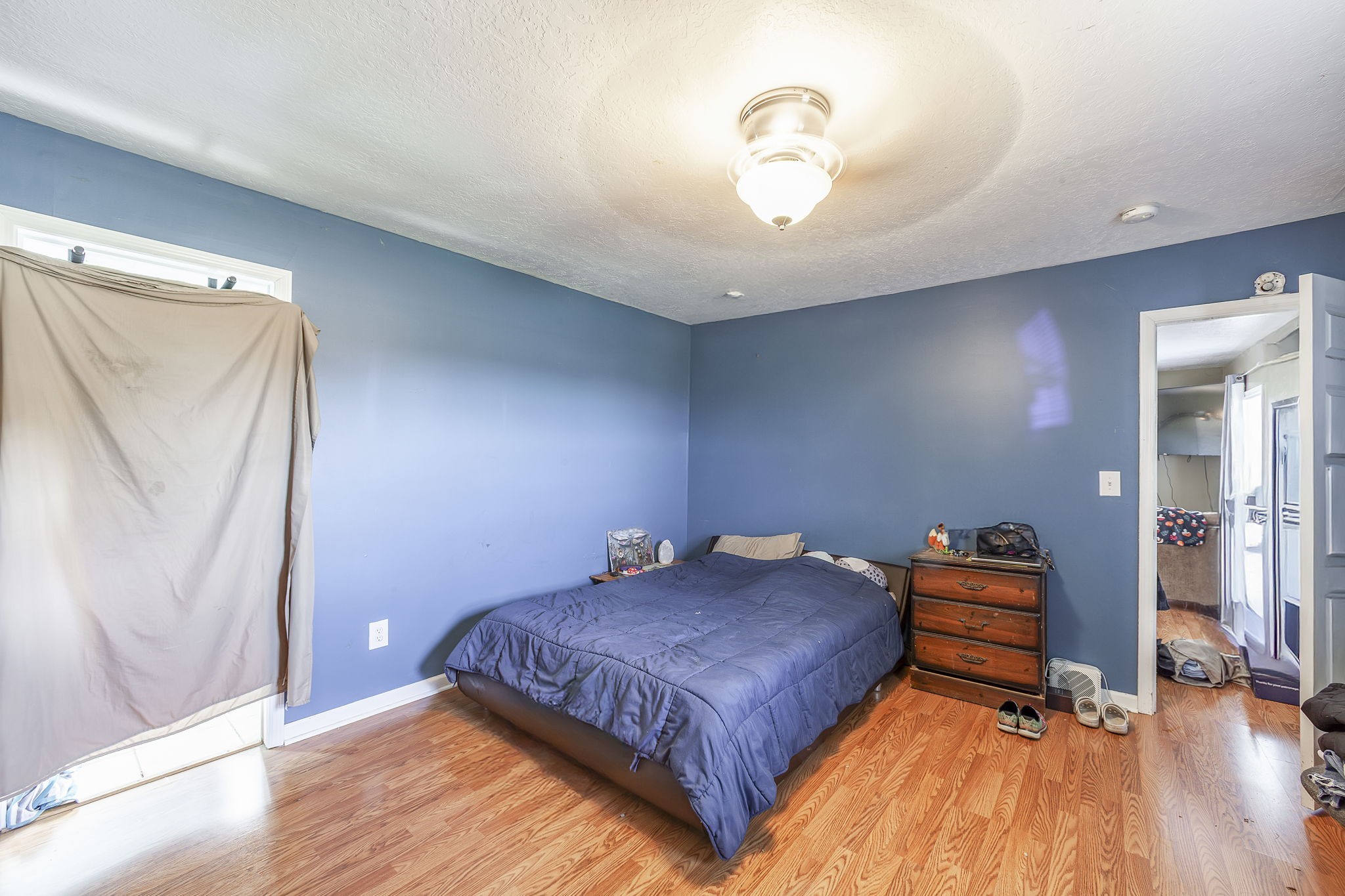 42 Jesse Patterson Road Trenton, TN 38382 - Photo 23 of 27 a bedroom with a bed and wooden floor