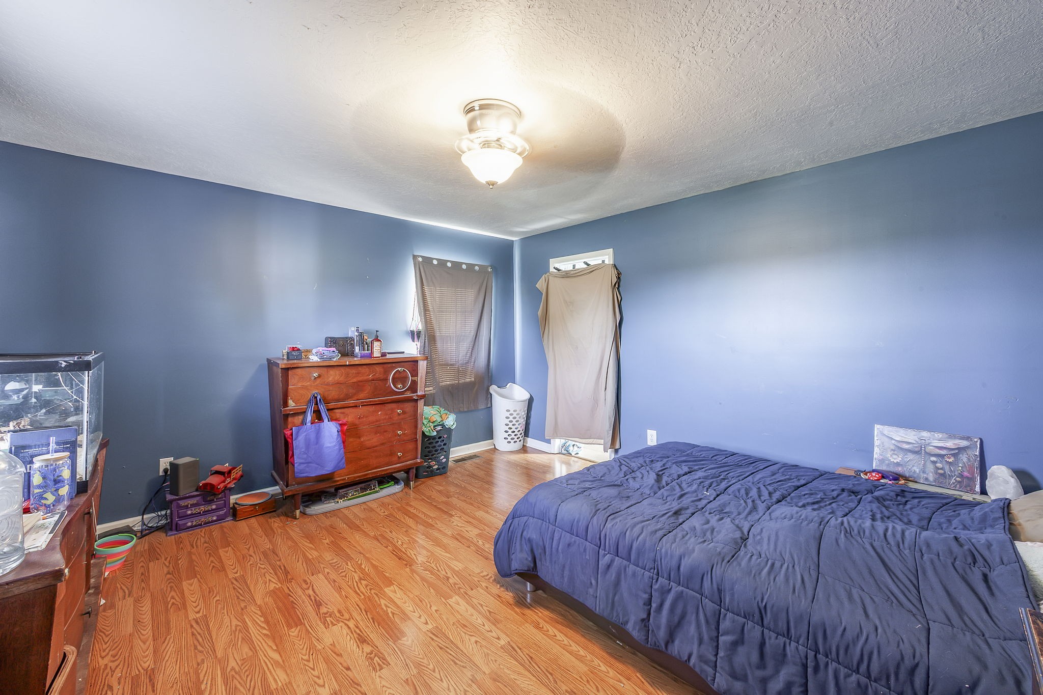 42 Jesse Patterson Road Trenton, TN 38382 - Photo 24 of 27 a bedroom with a bed and a chandelier