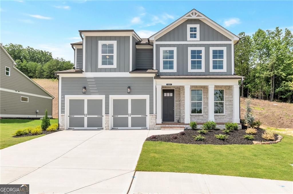 333 Willow Cove Canton, GA 30114 - Photo 1 of 37 a front view of a house with a yard and garage