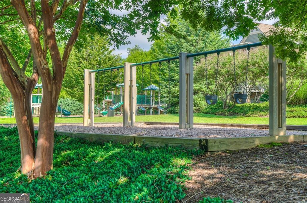 333 Willow Cove Canton, GA 30114 - Photo 33 of 37 a view of a yard with large trees and a barn